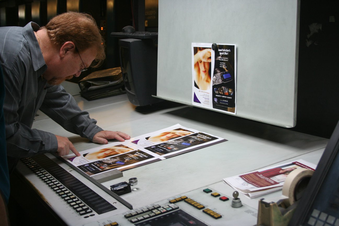 Bob Saint John reviewing print proofs