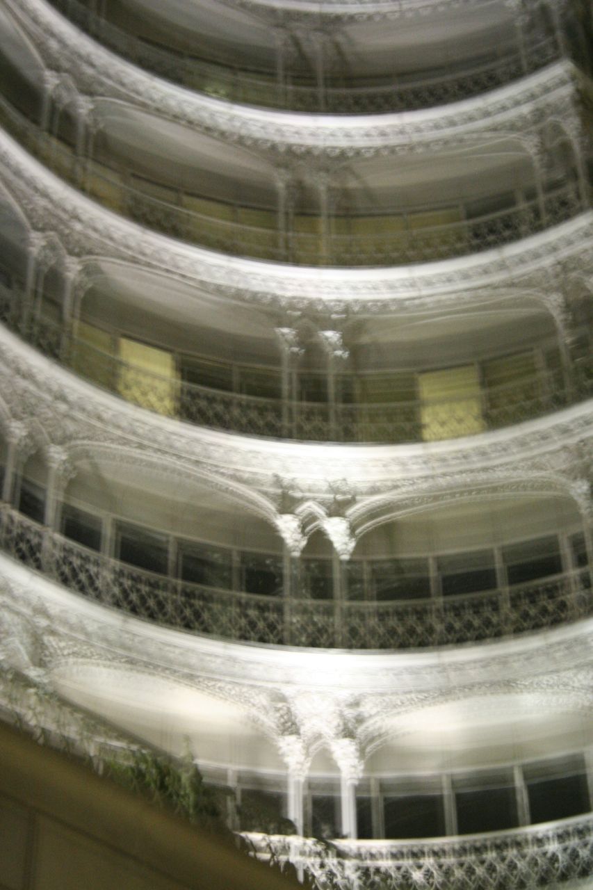 Multi-story civic atrium with ornate balcony rails