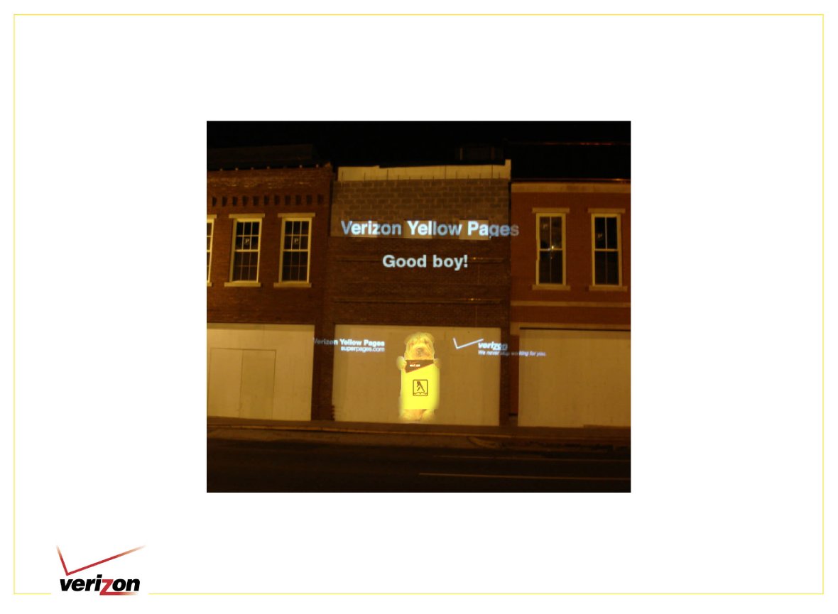 Verizon Yellow Pages Good boy campaign projected onto a building at night
